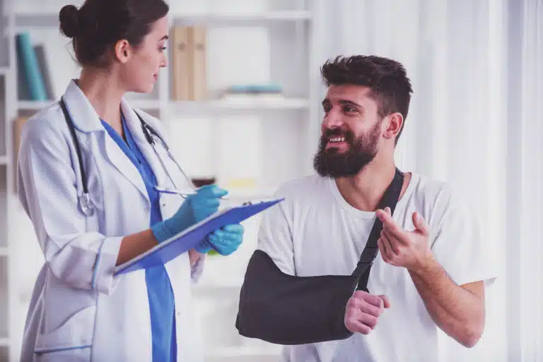A Doctor talking with a patient after a car accident