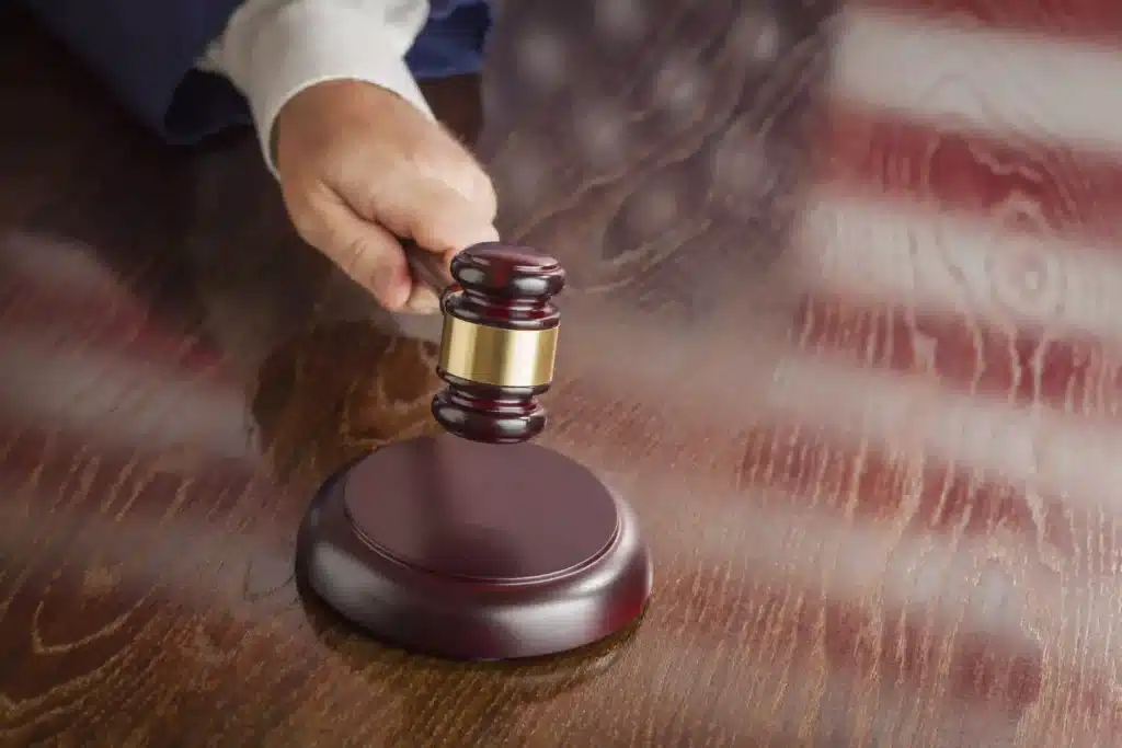 Gavel About to Strike on Wood Table Top
