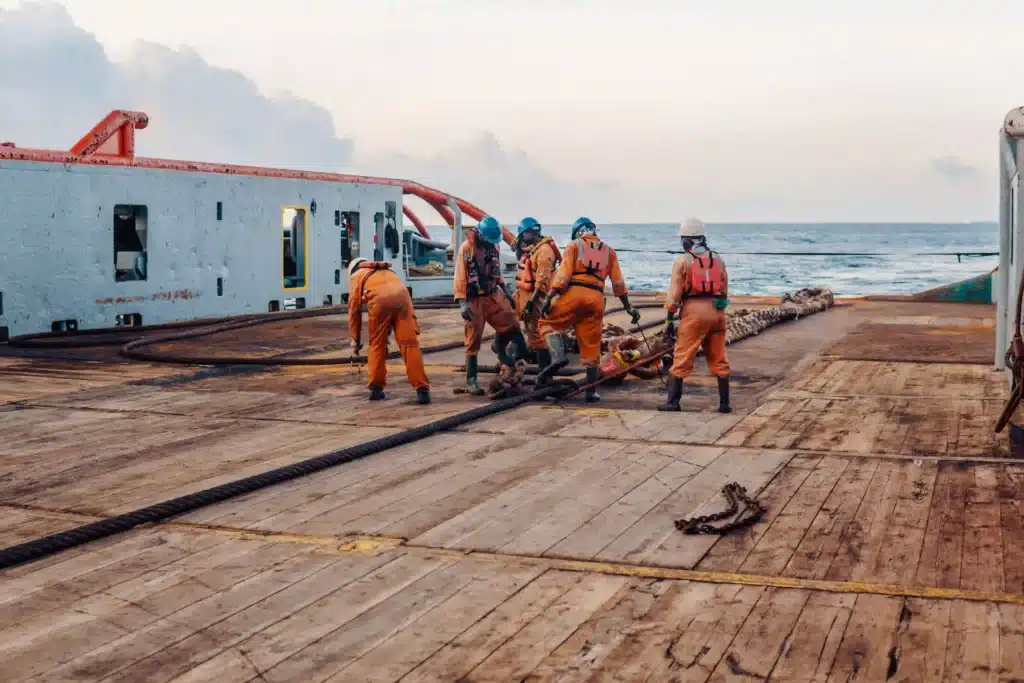 crew-working-with-ropes-on-ship-deck-