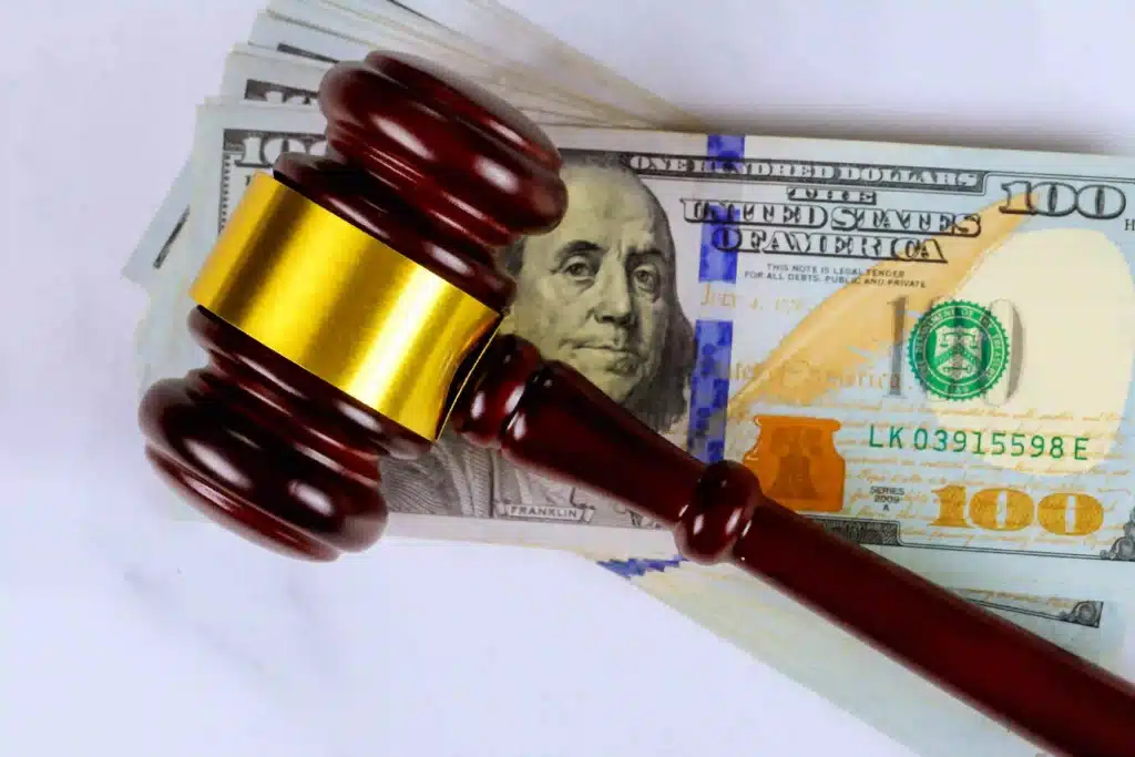 wooden-gavel-resting-on-a-stack-of-united-states-h-