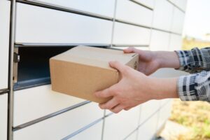 A DHL driver putting a package in a mailbox. What to do if I’m in an accident with a DHL truck?