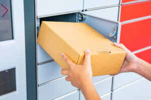 A FedEx driver putting a package in a mailbox. What to do if I’m in an accident with a FedEx truck?
