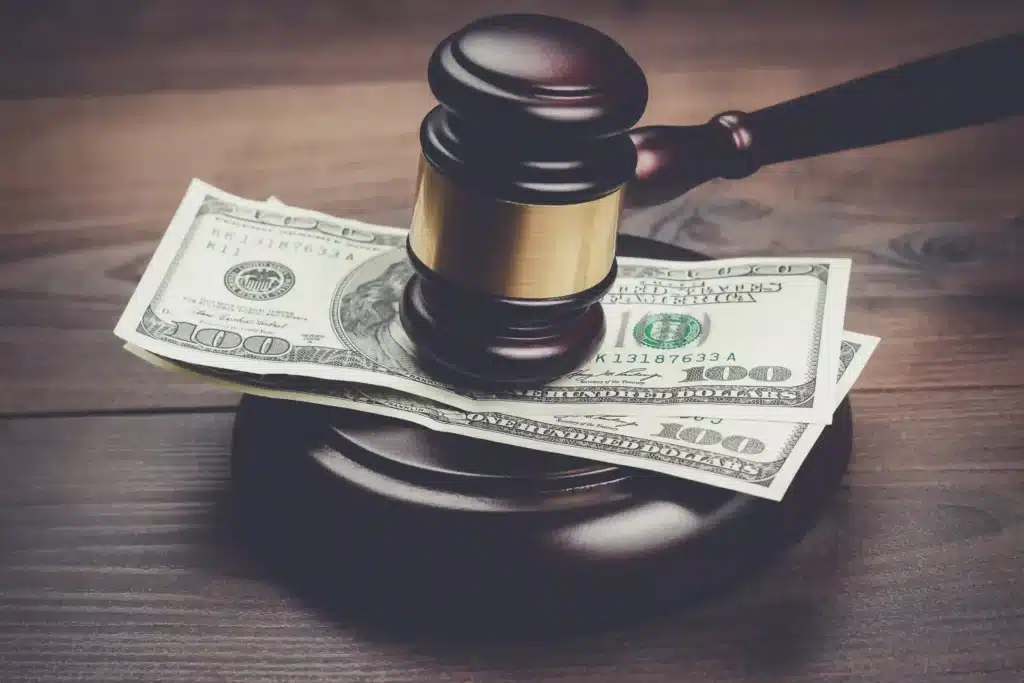 gavel-and-money-on-a-dark-wood-table-
