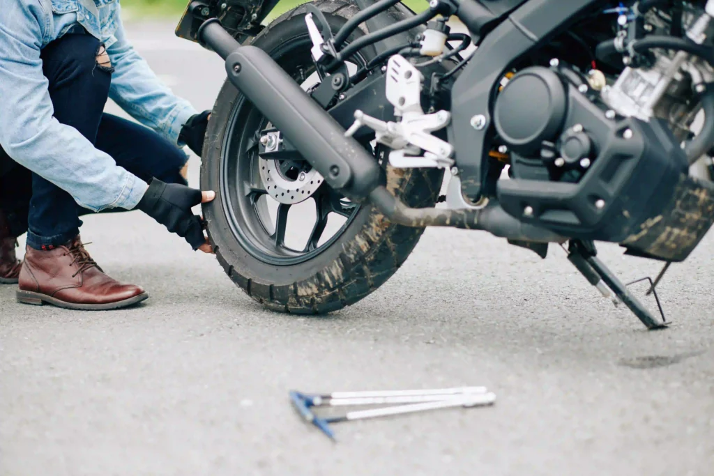 repairing-a-motorcycle-tire-on-the-roadside-