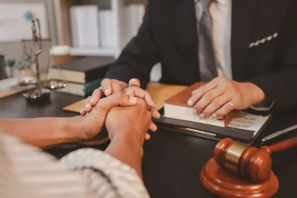 Attorney Comforting Client with Legal Advice at Office