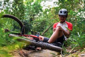 A crashed cyclist holding their leg. How long do bicycle accident cases take in Louisiana?