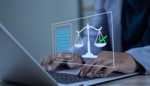 A minor car accident victim on the computer, searching to find out if they should call a lawyer after a minor car accident.