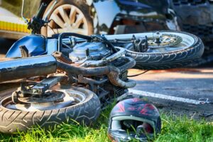 A crashed motorcycle with a helmet on the street. What evidence is needed in a motorcycle accident case?