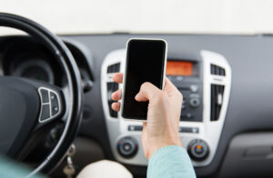 A man texting while driving. What evidence is needed to support a distracted driving claim in Louisiana?