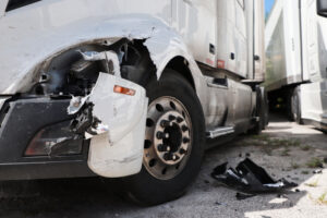 A close-up of a smashed truck. Who can be held liable in an overloaded truck accident in Louisiana?