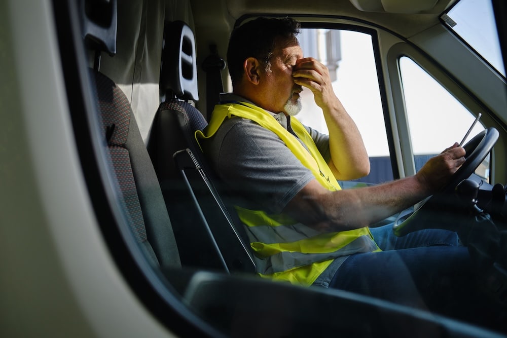 truck driver suffering from fatigue