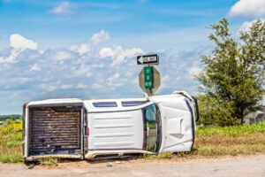 A rolled-over truck on the side of the road. What vehicles are most prone to rollovers?