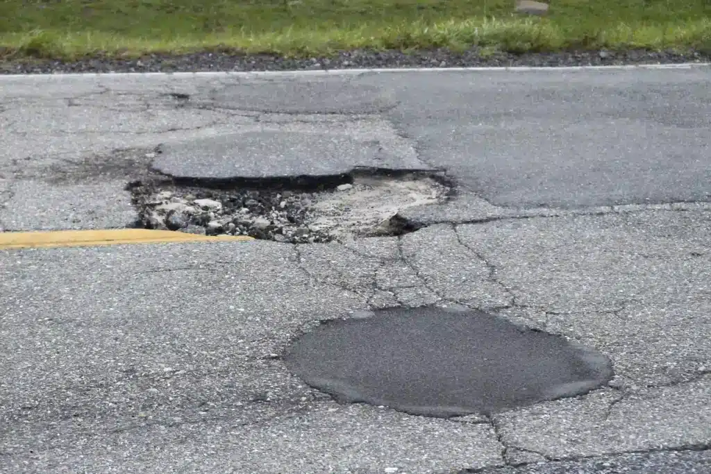 Pothole Damage on Gray Asphalt Road Surface