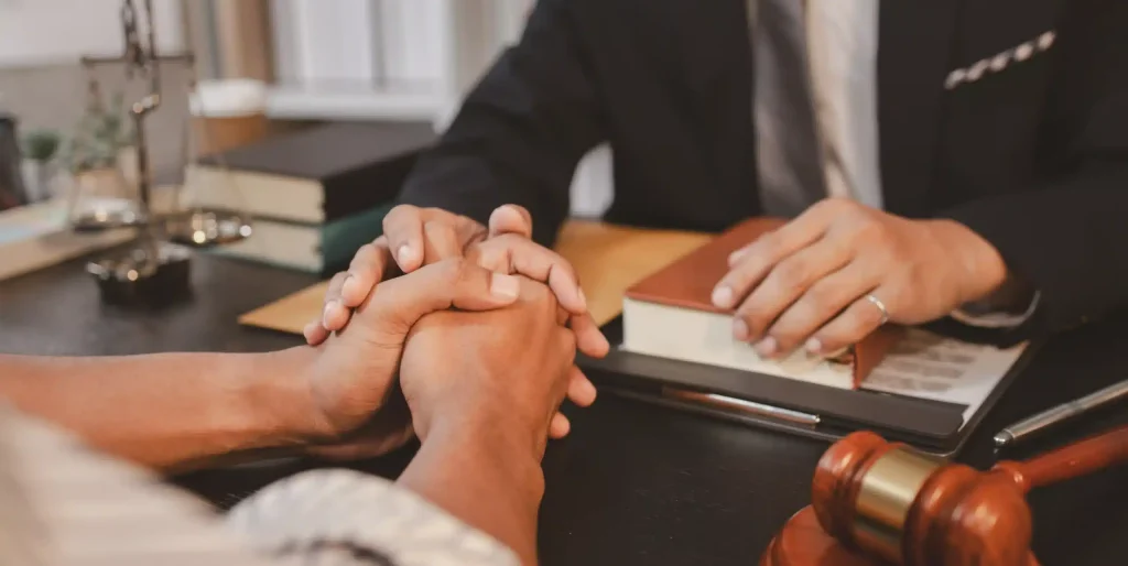 Attorney Comforting Client with Legal Advice at Office