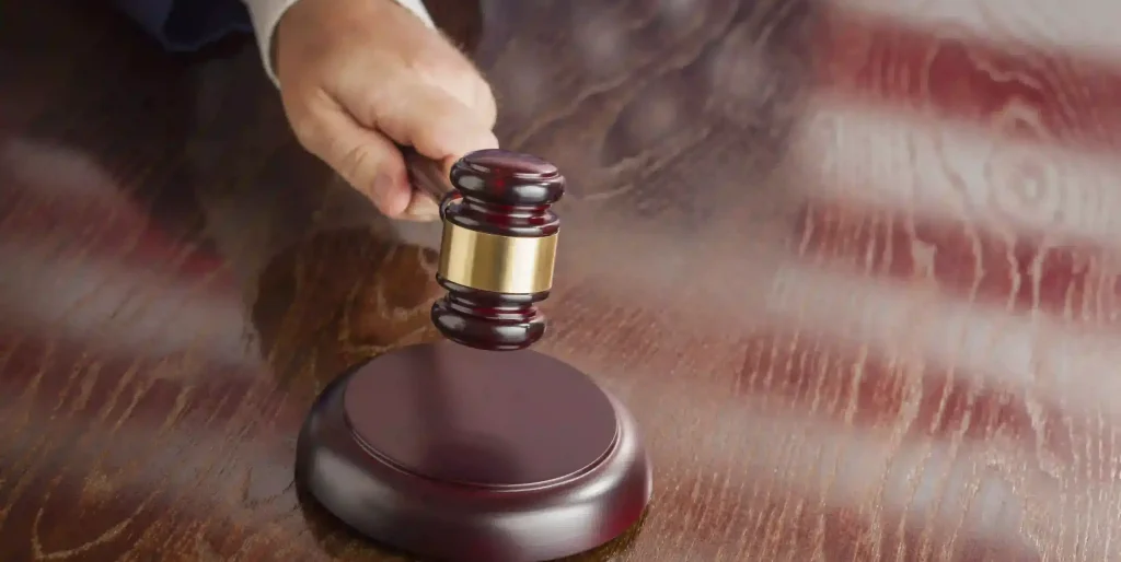 Gavel About to Strike on Wood Table Top