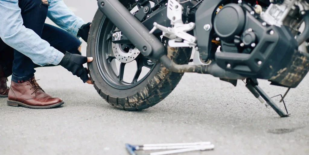 repairing-a-motorcycle-tire-on-the-roadside-