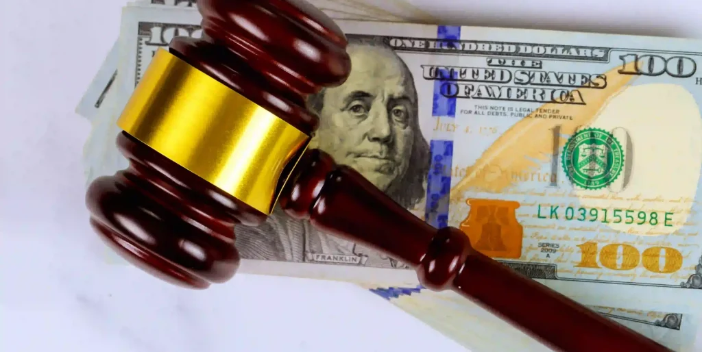 wooden-gavel-resting-on-a-stack-of-united-states-h-